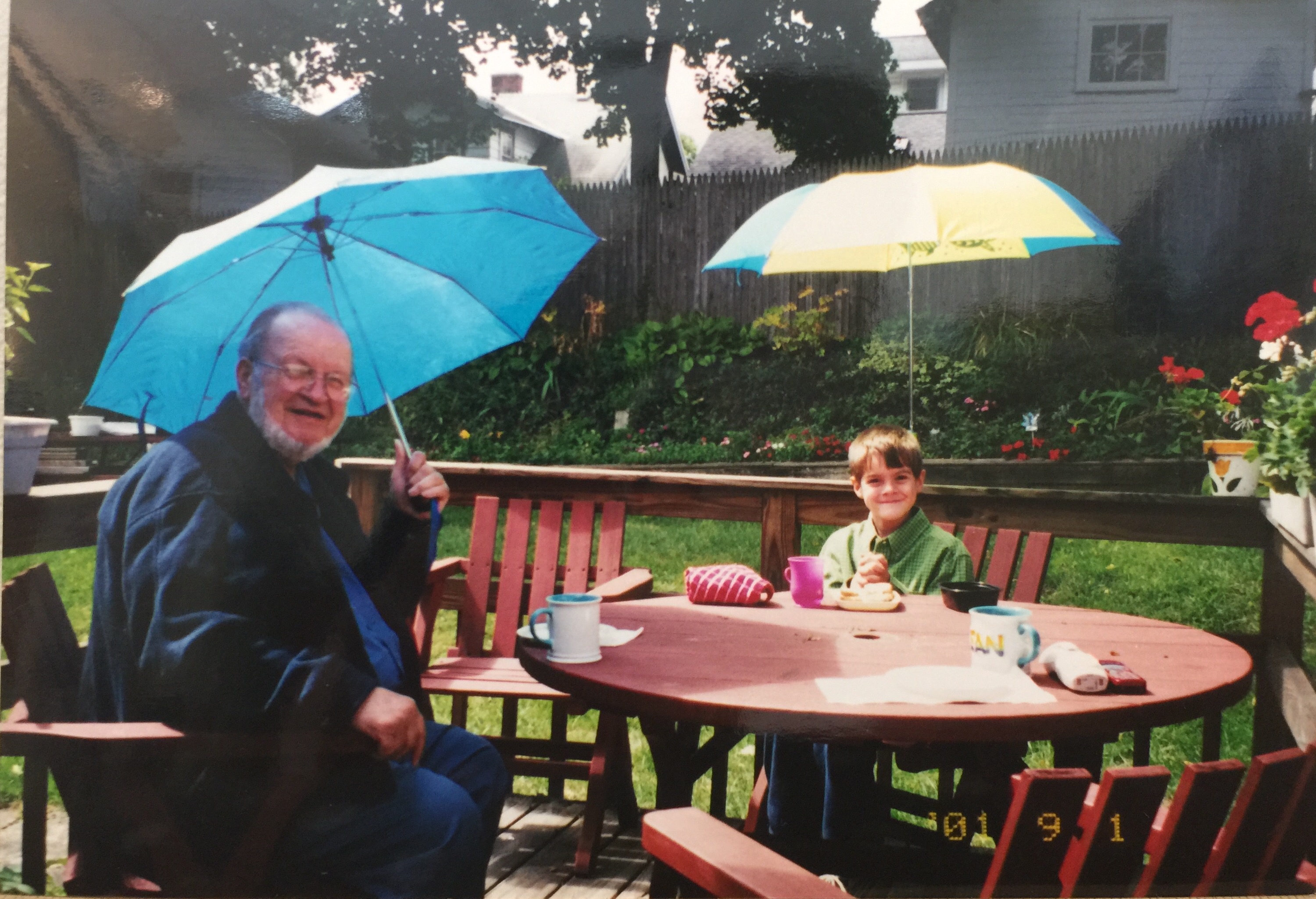 Spending time with Grandpa while enjoying our new umbrellas!